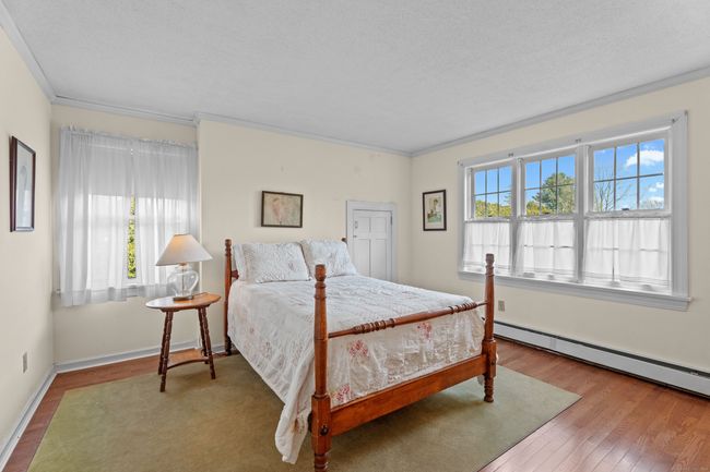 Bedroom 4 with access to a walk out stoage area over the garage. | Image 32