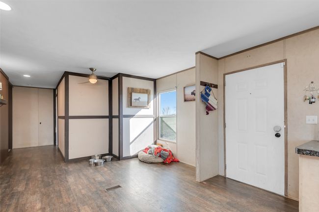 Entrance foyer with wood finished floors and visible vents | Image 17