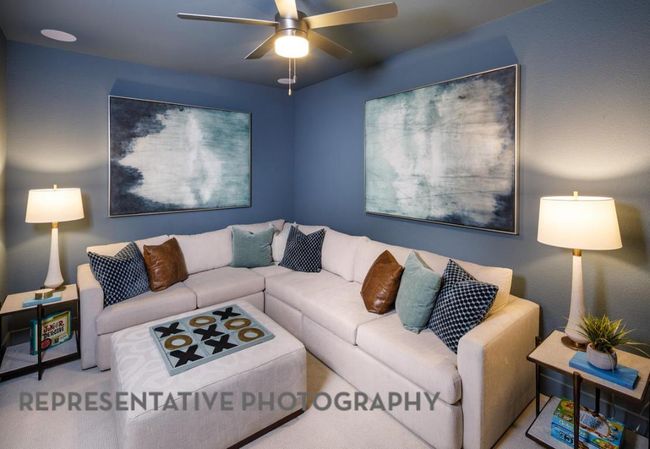 Living area with a ceiling fan and carpet | Image 32