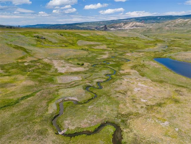 Drone / aerial view featuring a water and mountain view | Image 5