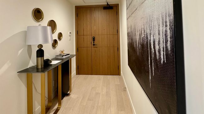Hallway with light wood-style flooring | Image 16