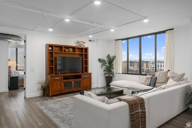 Living room with LVP flooring and raised ceiling height | Image 6