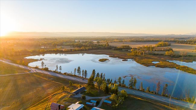 Aerial view at dusk featuring a water view | Image 61