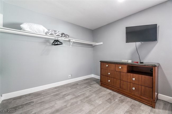 Spacious closet featuring light wood-style flooring | Image 25
