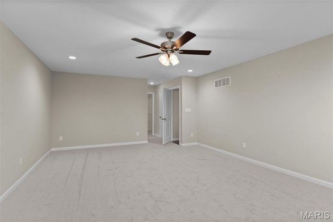 Empty room featuring ceiling fan, recessed lighting, light carpet, and baseboards | Image 19