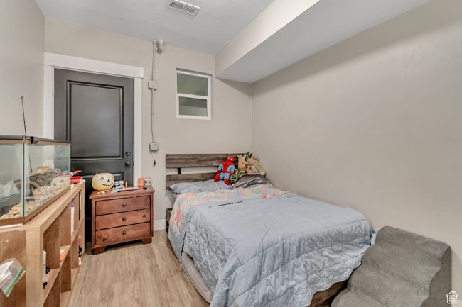 Bedroom featuring wood finished floors | Image 12