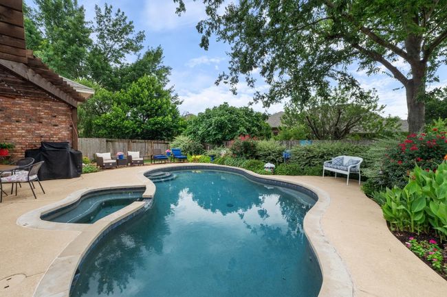 View of pool featuring a pergola, fenced backyard, outdoor dining area, and a pool / hot tub. | Image 30