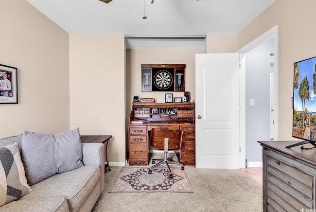 Carpet and a textured ceiling | Image 9