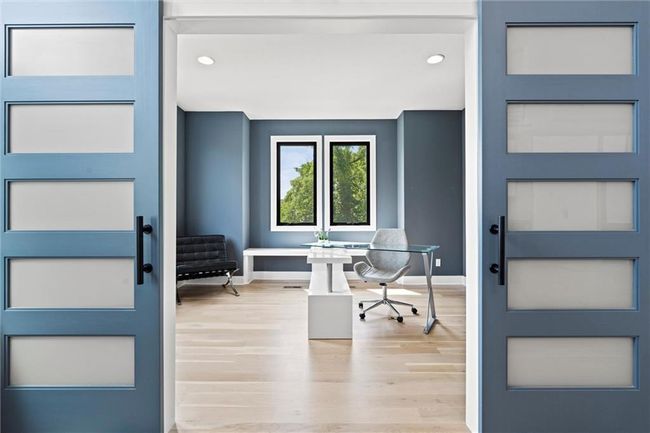 Home office featuring wood finished floors and recessed lighting | Image 8