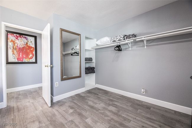 Walk in closet featuring wood finished​​‌​​​​‌​​‌‌​‌‌​​​‌‌​​‌‌​‌​​​​​‌ floors | Image 28