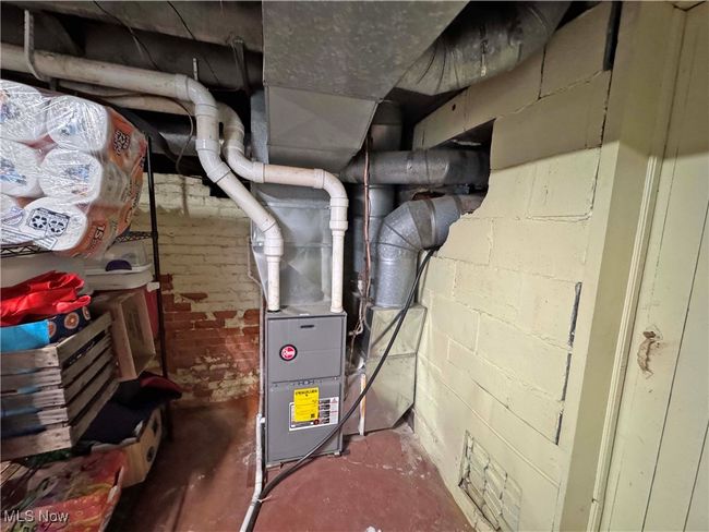 View of utility room featuring furnace | Image 44