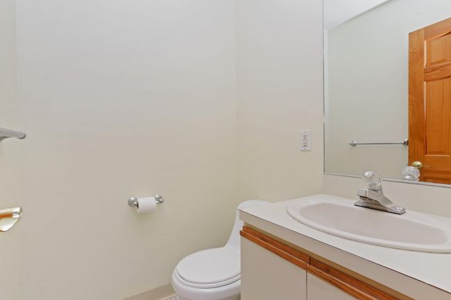 Bathroom featuring vanity and toilet | Image 9