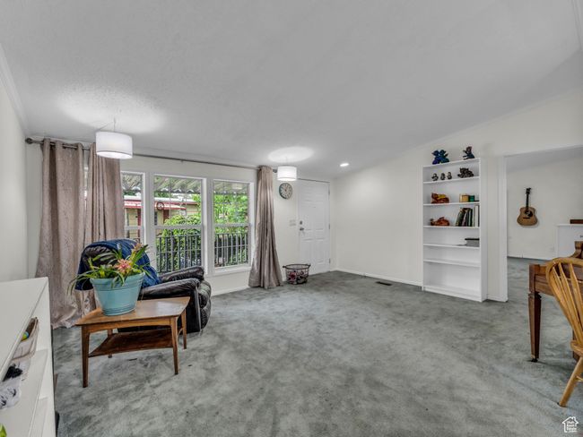 Living room featuring carpet floors and baseboards | Image 6