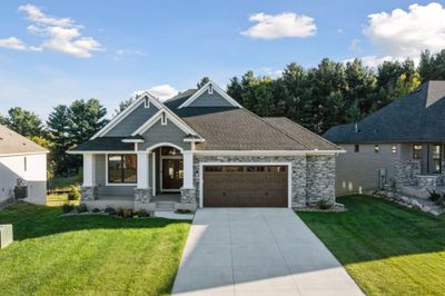 Welcome to 11411 Kings Ct N in Lake Elmo. This detached villa is within The Royal Golf Club neighborhood where you enjoy access to a fitness center and pool and the option to join this prestigious club with a championship caliber course. | Image 1