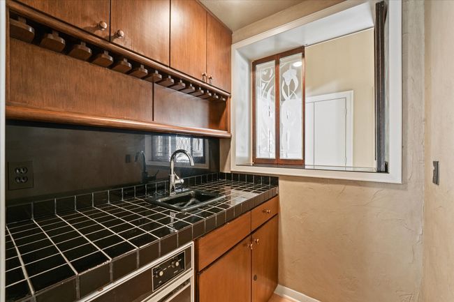 Bar area with plenty of storage | Image 15