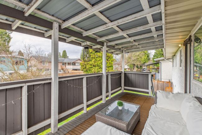 Deck featuring outdoor lounge area and a residential view | Image 34