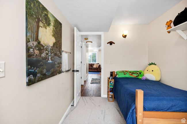 Basement Bedroom with carpet flooring and baseboards | Image 20