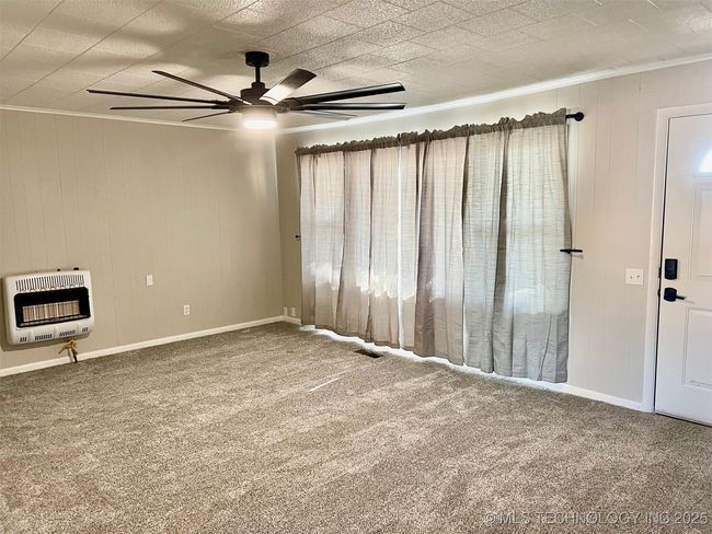Living room with backup gas heater | Image 10