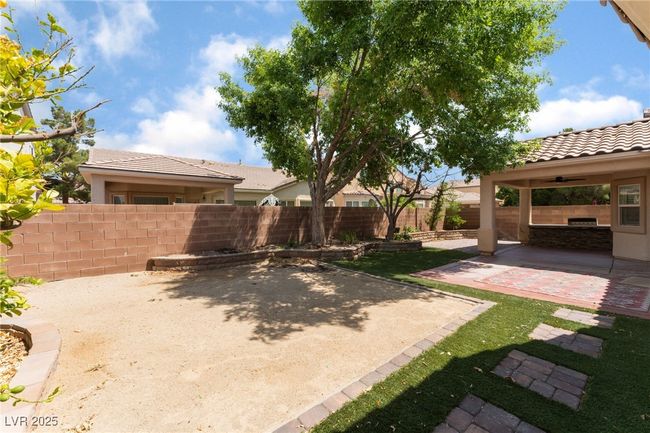 Fenced backyard featuring a ceiling fan and a patio | Image 45