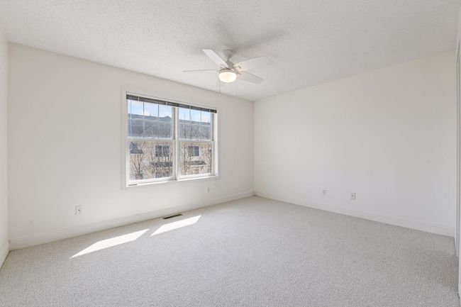Primary bedroom with ceiling fans | Image 26