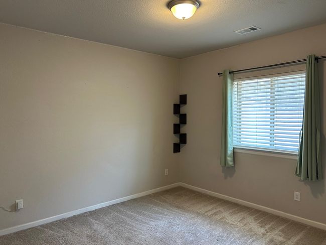 Empty room with baseboards, carpet floors, and a textured ceiling | Image 19