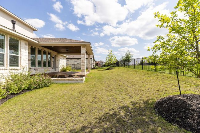 View of yard with ceiling fan and a patio area | Image 32