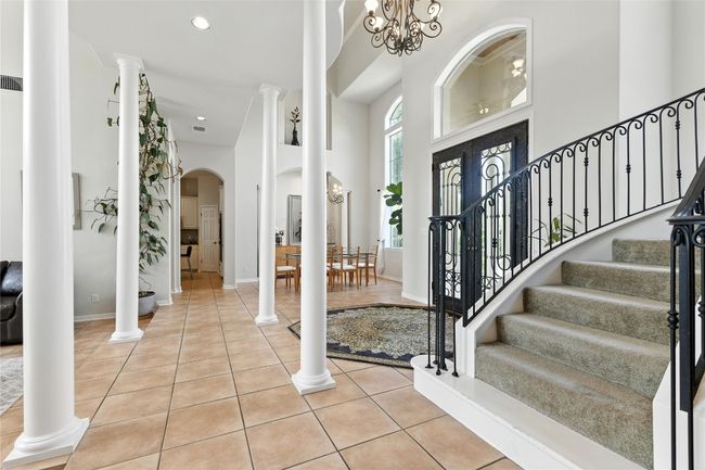 Entryway featuring arched walkways, stairway, tile patterned floors, a towering ceiling, and recessed lighting | Image 24