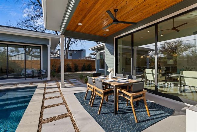 View of patio / terrace featuring a ceiling fan and outdoor dining area | Image 33