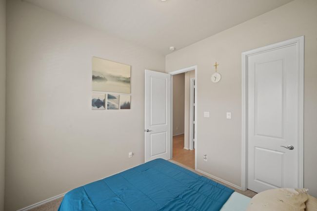 Third bedroom features largewindows and plush carpet. | Image 29