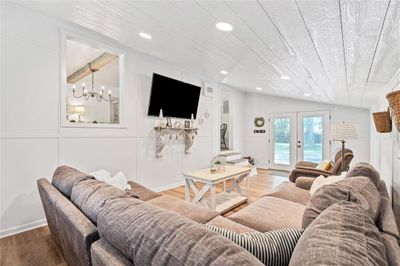 family room has LVP and wainscoting | Image 3