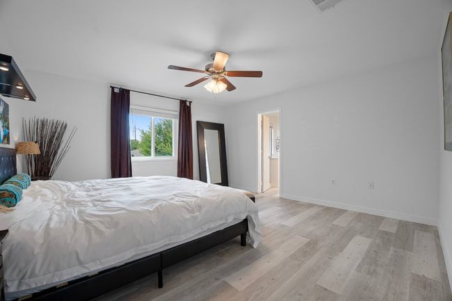 Bedroom featuring light wood-style floors and ceiling fan | Image 20