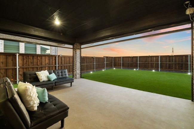 Patio terrace at dusk featuring an outdoor living space and a yard | Image 24