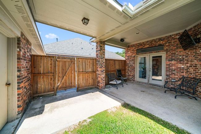 Comfortable covered patio and detached garage pathed connection | Image 36