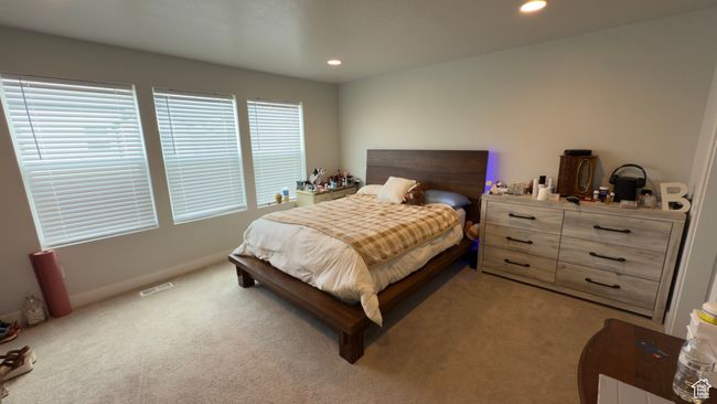 Bedroom with light carpet and recessed lighting | Image 13