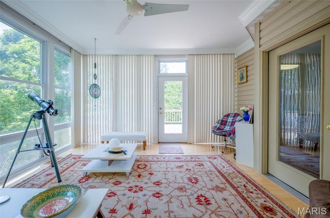 Sunroom featuring ornamental molding | Image 18