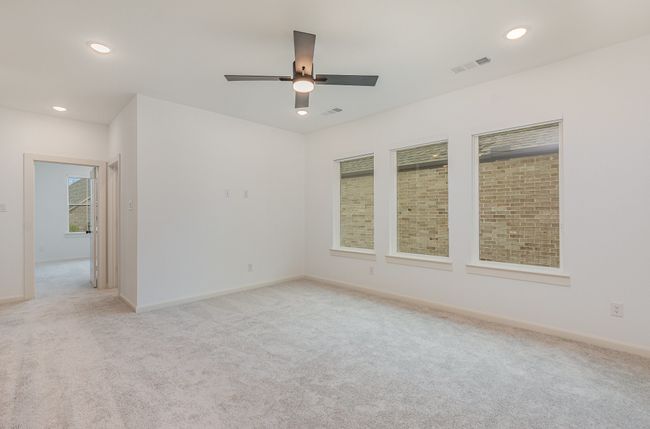 Empty room with a ceiling fan, light carpet, and recessed lighting | Image 18