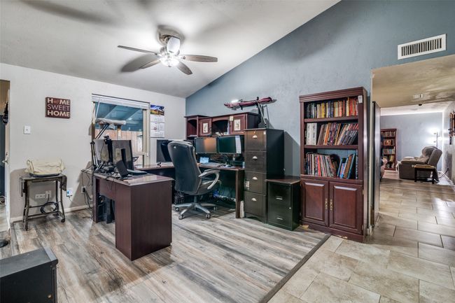 Office area featuring vaulted ceiling and a ceiling fan | Image 14