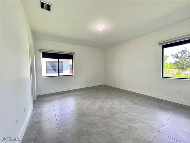 Spare room featuring light tile patterned floors | Image 18