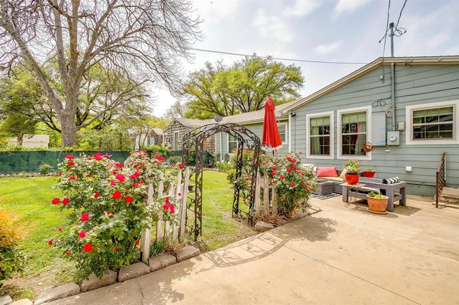View of yard featuring an outdoor living space, fence, and a patio | Image 8