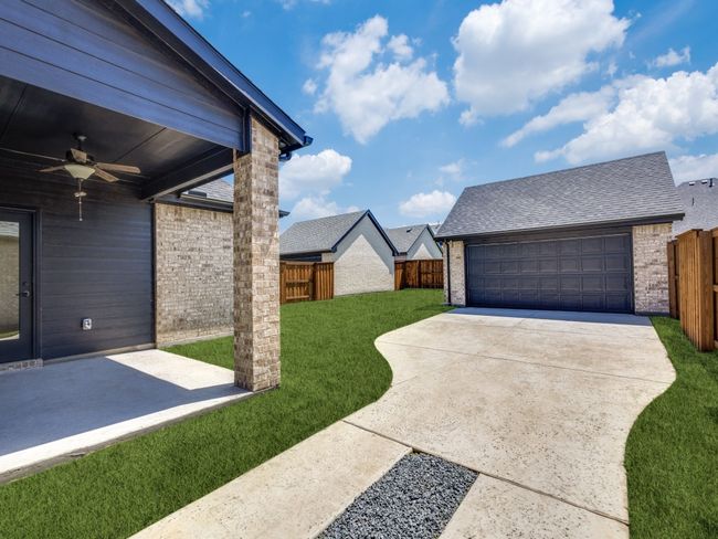 This wonderful home offers a detached, 2 car garage with extra long drive allowing for plenty of private parking space. | Image 19