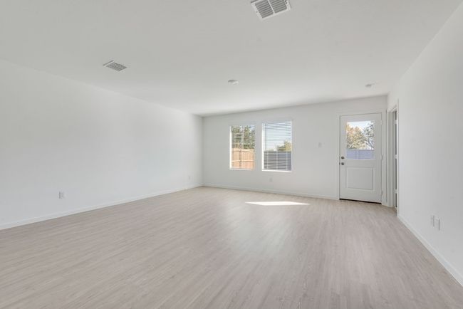Unfurnished room featuring light wood finished floors and baseboards | Image 6