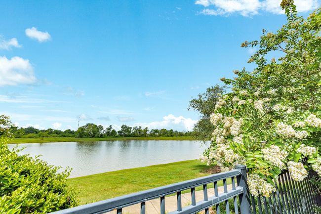 view of the lake from the back fence | Image 48