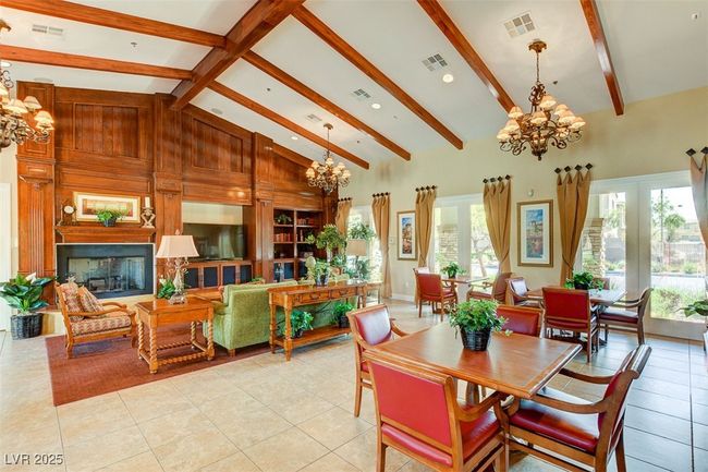 Dining room with a chandelier, healthy amount of natural light, light tile patterned floors, and recessed lighting | Image 71
