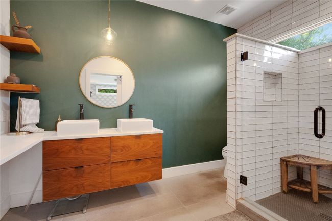 Primary bath featuring frameless glass walk-in shower, double vanity and quartz countertops | Image 18