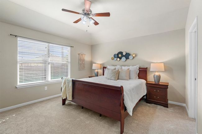 The primary suite offers large windows for natural light. (All windows have a anti-theft security alarm on them) | Image 13