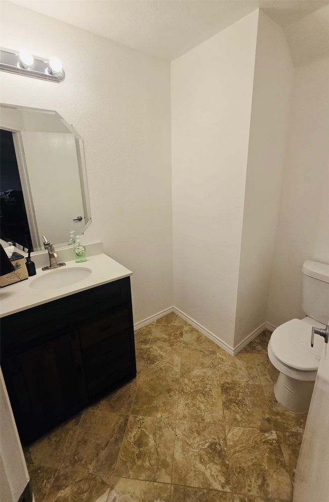 Bathroom featuring stone finish flooring and vanity | Image 16