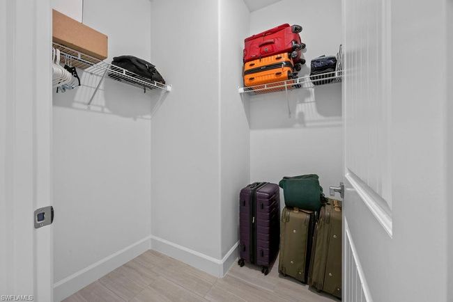 View of walk in closet | Image 11