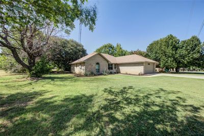 Ranch-style home featuring a front lawn | Image 2