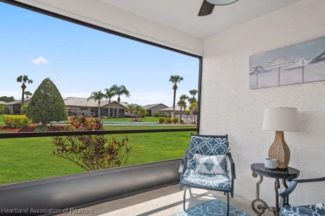 screened lanai w/ view of shuffleboard and pool | Image 21