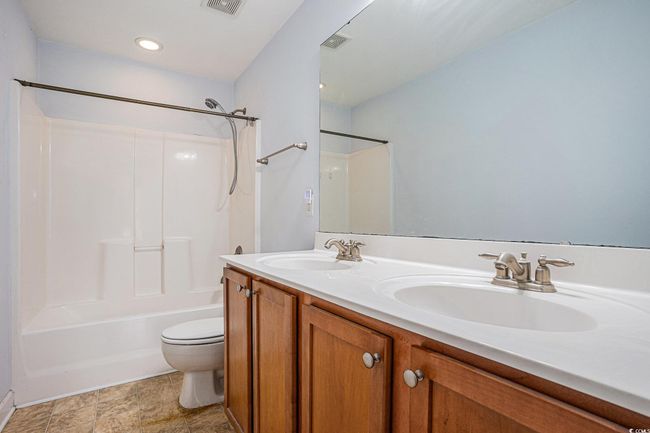 Full bath with bathing tub / shower combination and double vanity | Image 12